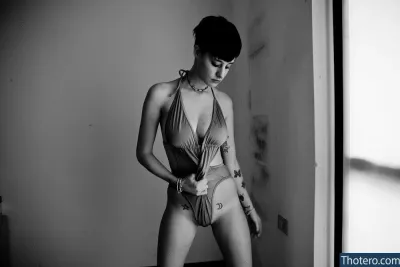 Sarah Manzoni - there is a woman in a bikini posing in a room