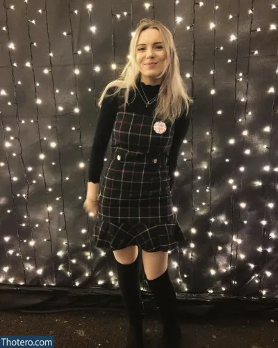 missbaffytwich - woman in a plaid dress and knee high boots standing in front of a backdrop of lights