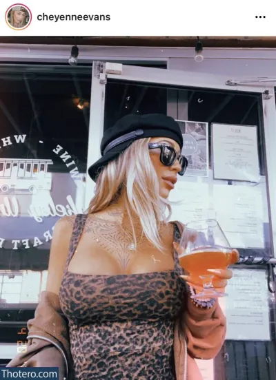 Cheyenne Evans - blonde woman in leopard print dress holding a glass of beer