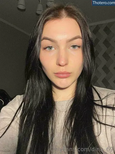 dina_69 - woman with long black hair and a gray shirt