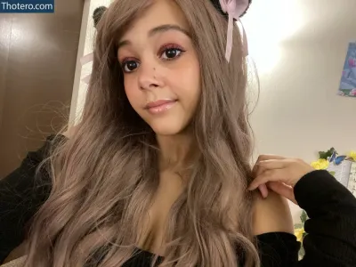 ASMR Aspen - woman with long hair wearing a black top and a cat ears