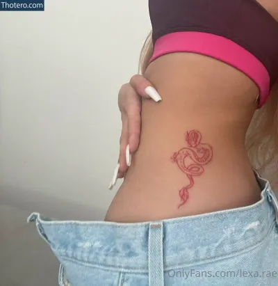 lexarae - woman with a tattoo of a rose on her stomach