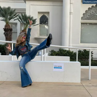 Jade Pettyjohn - woman in jeans and a denim jacket sitting on a wall