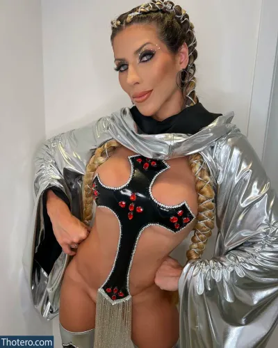 Ana Paula Minerato - woman in a shiny silver outfit posing for a picture