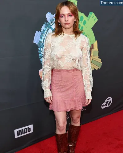 Alexis G Zall - wearing a pink skirt and brown boots at an event