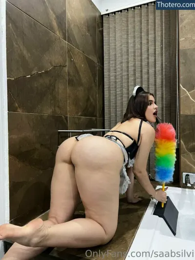 Saabsilvi - in a bathroom with a rainbow duster on her butt