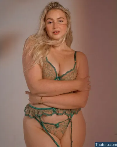 Iskra Lawrence - woman in a green lingerie posing for a picture