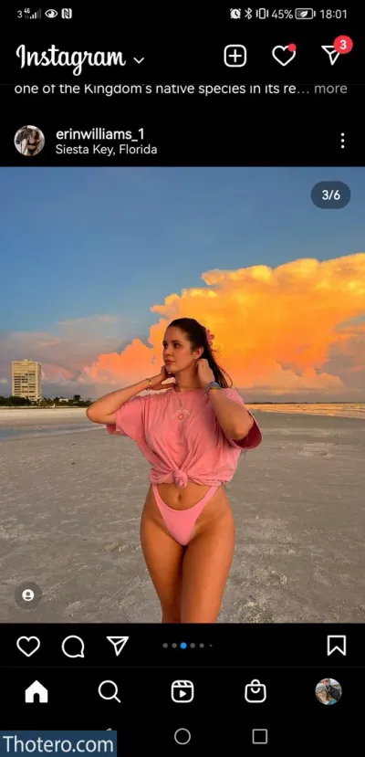 Erin Williams - a close up of a person in a pink shirt on a beach