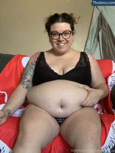 hela.stoned.bbw - woman in black bra top sitting on a red blanket