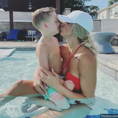 Kayla Lynne Hilton - and a boy in a swim suit kissing in a pool