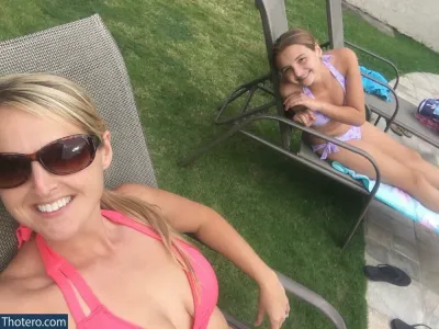 HealthyHappyFitandProud - woman and child in pink bikinis sitting on lawn chairs