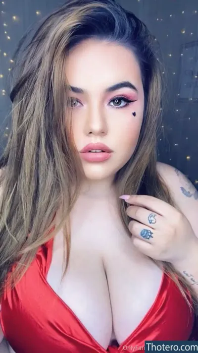 babygiirl45 - a woman with long hair wearing a red dress and tattoos