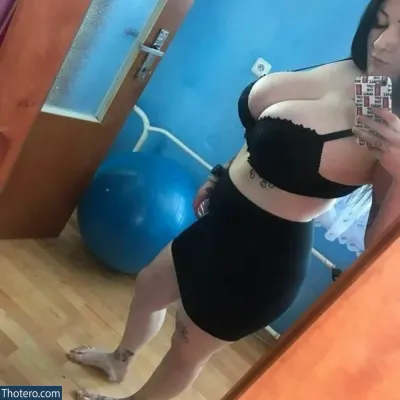inkedprincess90 - woman in a black bra top taking a selfie in a mirror