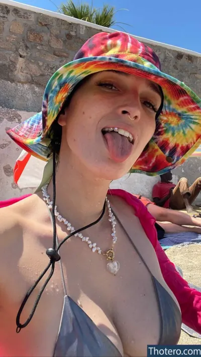 Dani Thorne - woman with a colorful hat on her head and a necklace