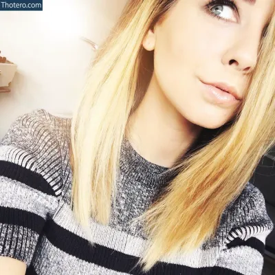 Zoë Sugg - blond woman with long hair and blue eyes posing for a picture
