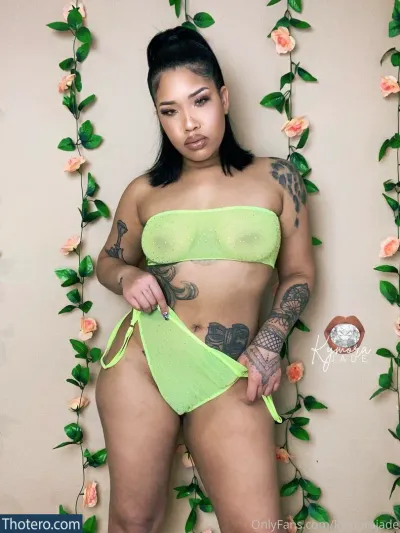 Kymora Jade - woman in a green bikini posing for a picture