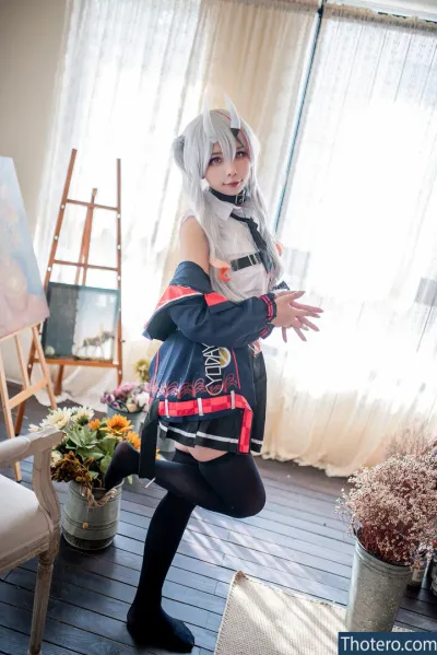 Murasaki - anime cosplay in a room with a chair and a painting