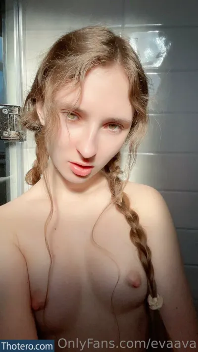 Evaava - woman with long hair and no shirt posing in a bathroom