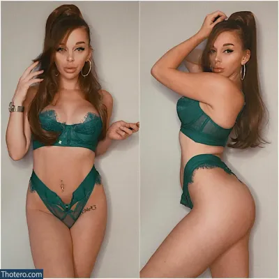 Ally AJ - in a green lingerie posing for a picture