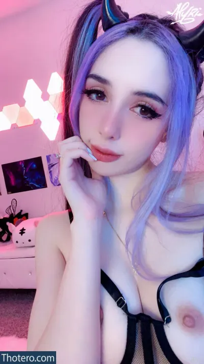 Alyri - a close up of a woman with purple hair and a cat ears