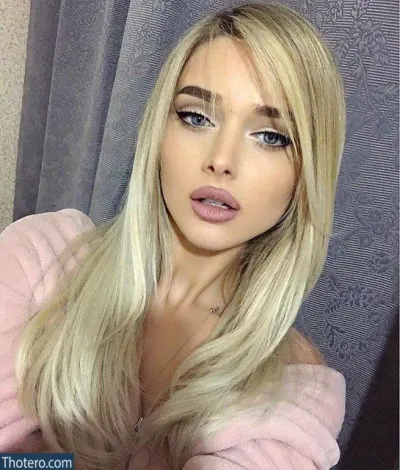marii212121 - a close up of a woman with long blonde hair and a pink sweater