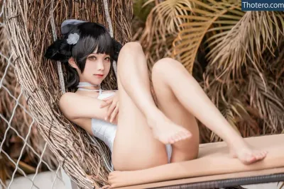 Chunmomo0127 - asian woman in a white swimsuit sitting in a hammock