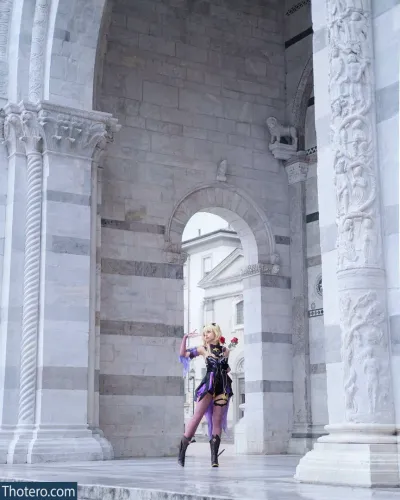 Himeecosplay - there is a woman in a purple outfit posing in front of a building