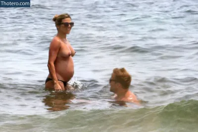 Zoe Hardman - pregnant woman in the water with her husband