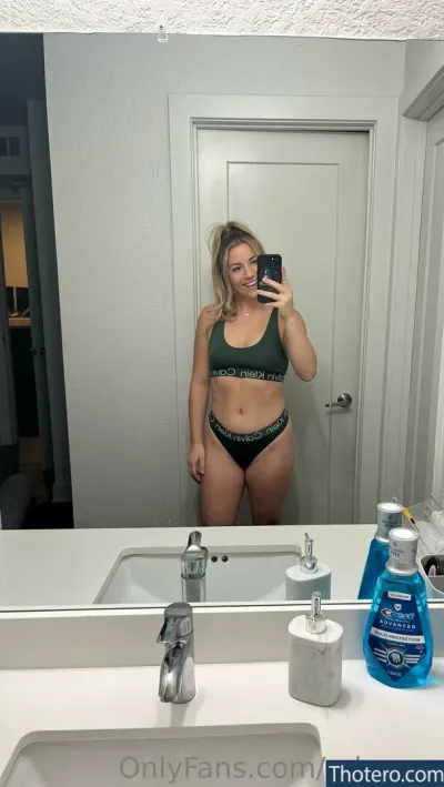 Ryleerex - woman in a bikini taking a selfie in a bathroom mirror