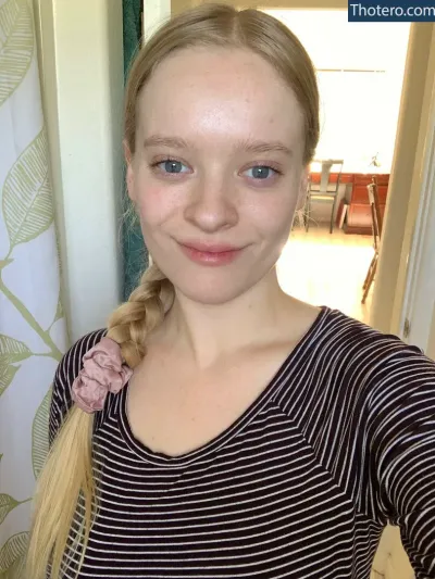 Kelley - woman with a braid in her hair and a striped shirt