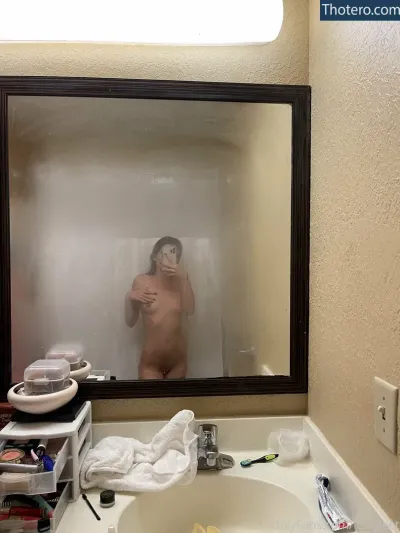 Kylee Tingstrom - there is a naked man taking a picture of himself in the mirror