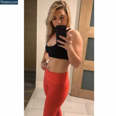 Jesmorse22 - woman in a black top and red pants taking a selfie