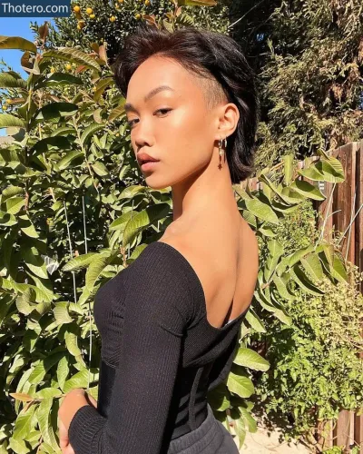 Tori Pareno - a close up of a woman with a black top and a black skirt