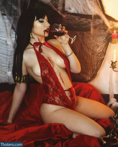Daisyylewd - woman in red lingerie drinking wine on bed