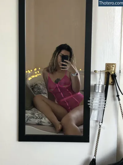 Whitendragons - woman in pink lingerie taking a selfie in a mirror