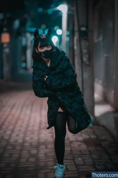Djawa Jenny - woman in a cat costume walking down a street