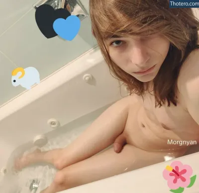 Morgnyan - there is a woman sitting in a bathtub with a teddy bear