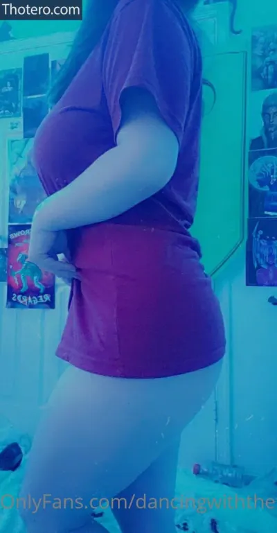 Dancingwiththefae - in a red shirt and blue skirt standing in a room