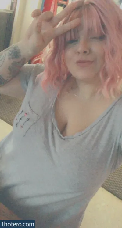 downwthethicccness - woman with pink hair and tattoos taking a selfie