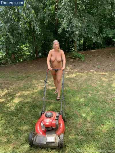 Lexy Rose - woman pushing a lawn mower in a yard