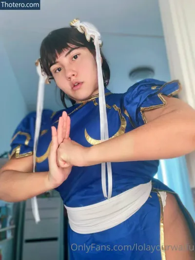 lolayourwaifu - woman in a blue costume is posing for a picture