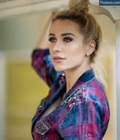 TeaseMe_N - woman with a messy bun in a colorful shirt