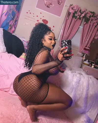 Jahara Daughtry - in a fishnet bodysuit taking a selfie in a bedroom