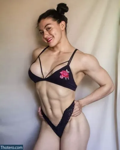 Keytt Vera - a woman in a bikini posing for a picture in a studio