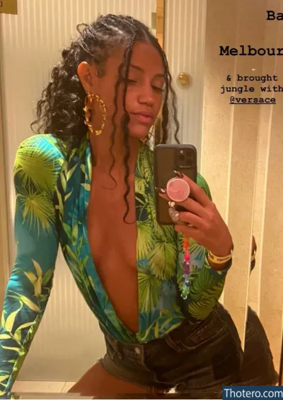 Vick Hope - woman taking a selfie in a bathroom mirror