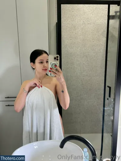 pinkyly - woman taking a selfie in a bathroom with a shower