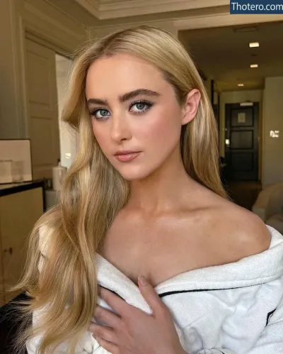 Kathryn Newton - a close up of a woman with long blonde hair wearing a towel
