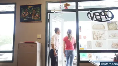 Michelle Waterson - there are two people standing in a doorway of a restaurant