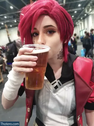 Apricot - woman with red hair drinking a beer in a convention