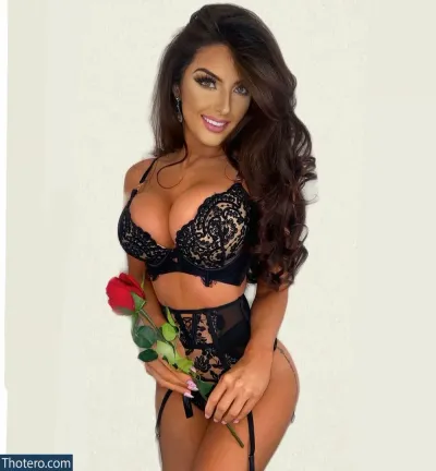 Kayleigh Rose Dematos - a close up of a woman in a black lingerie holding a rose